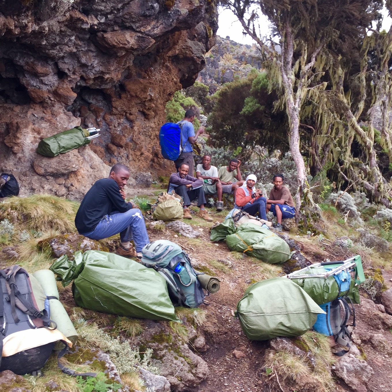 Porters with luggage pausing during the hike