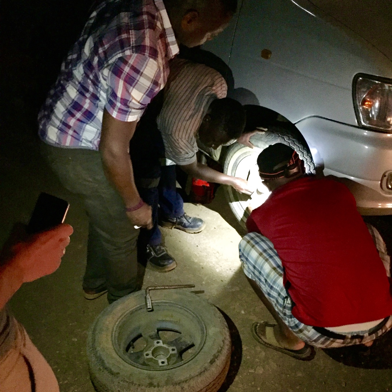 Changing tires during the trip to the airport