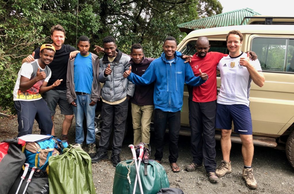 A group of satisfied mountaineers after a successful ascent of Kilimanjaro