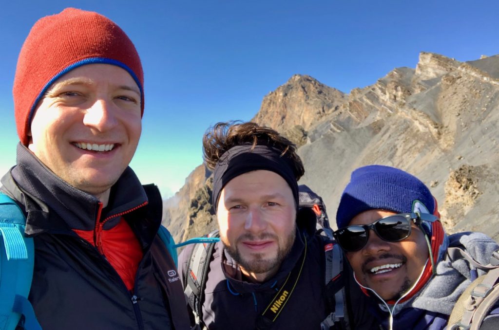 Two mountaineers with guide on Mount Meru