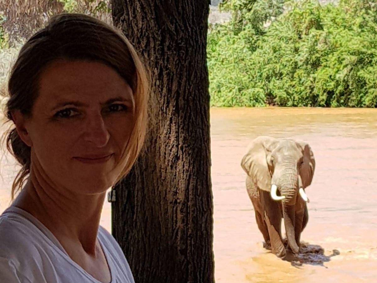 Ilona and elephant comes out of the water